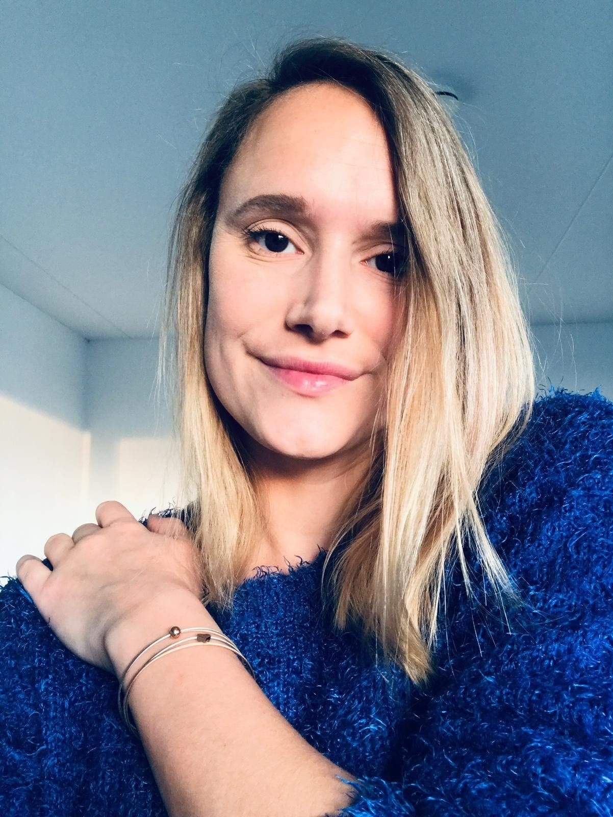 Woman wearing Thinking of You bracelet with bicolour star charm | CLIC by Suzanne