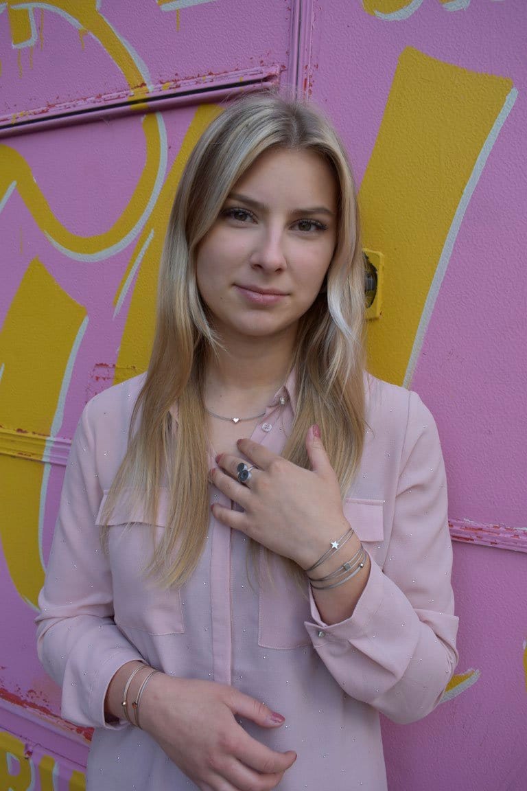 Woman wearing Thinking of You bracelet with silver-tone star charm | CLIC by Suzanne